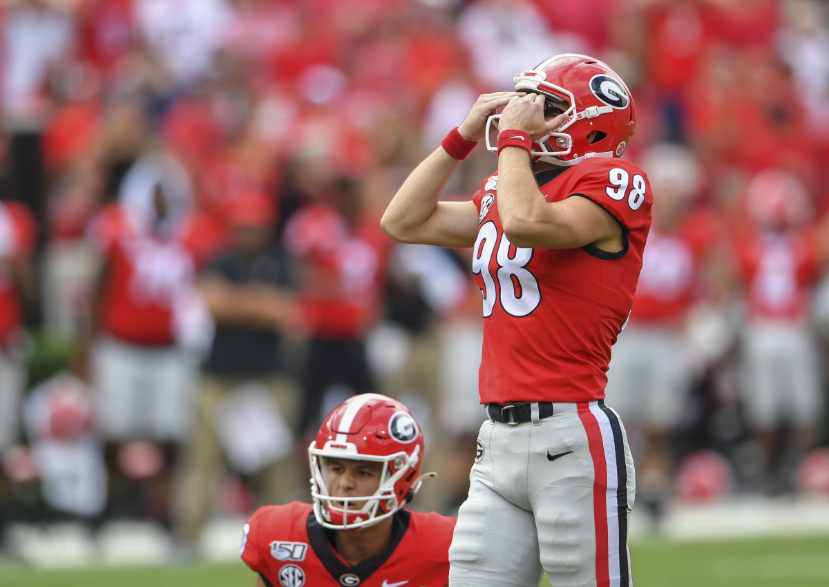 Rodrigo Blankenship reacting to missed field goal in double-overtime.